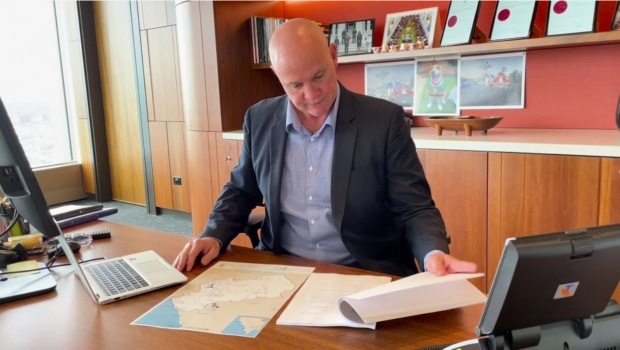 Minister for Water Glenn Butcher looking over documents from the new Barron Water Plan which will provide an additional 20,550 megalitres to far northern communities.